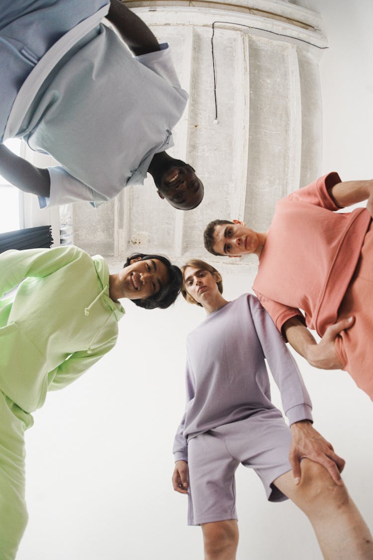 A Group Of Men Wearing Pastel Color Clothes