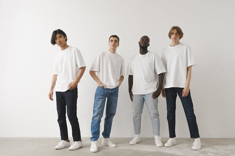 Men In White Shirt Standing Near White Wall