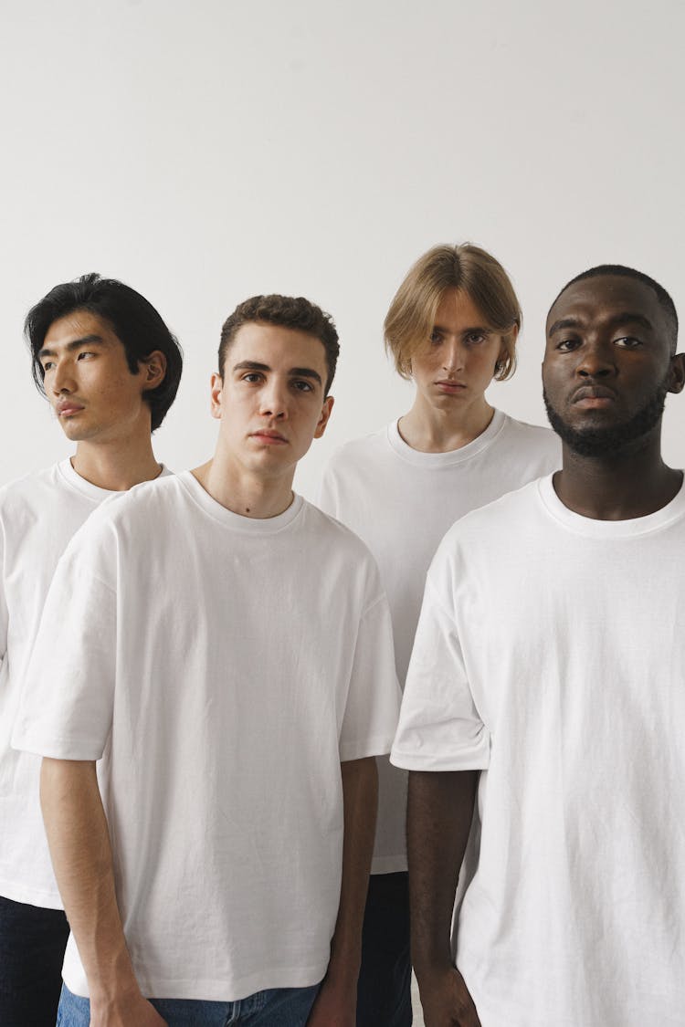 A Group Of Men Wearing White Shirt