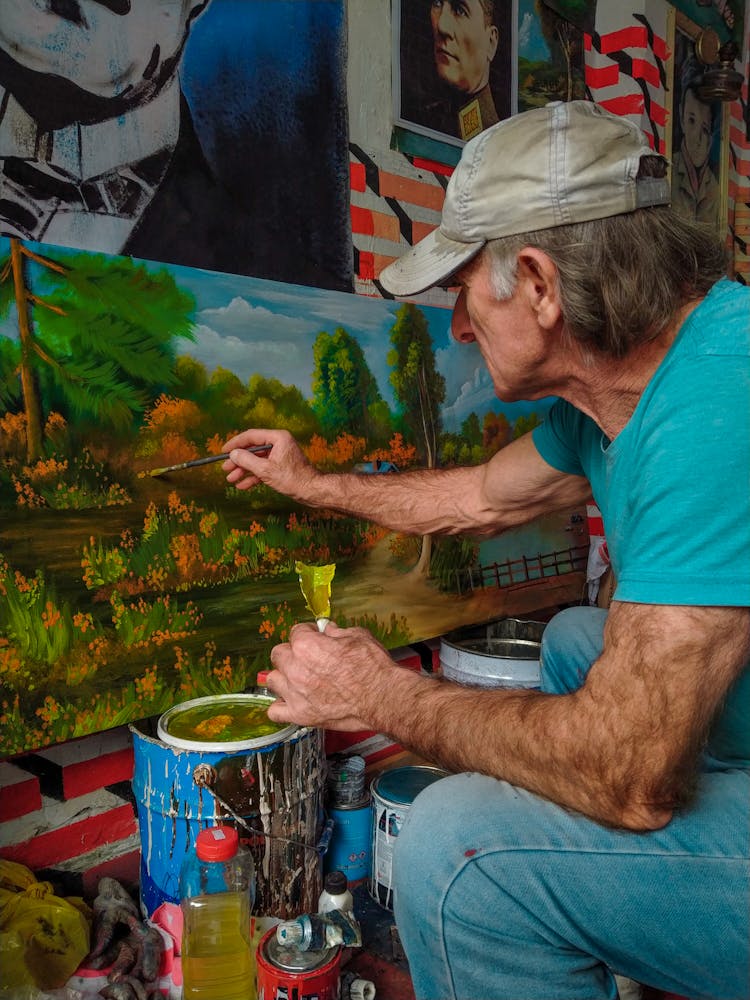 Photo Of A Man Painting