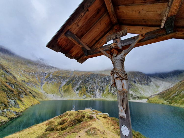 Wooden Crucifix Near A Lake