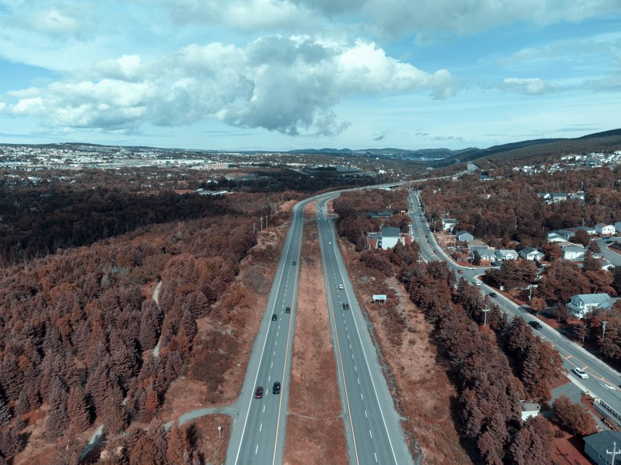 Aerial view of a highway cutting through open landscape