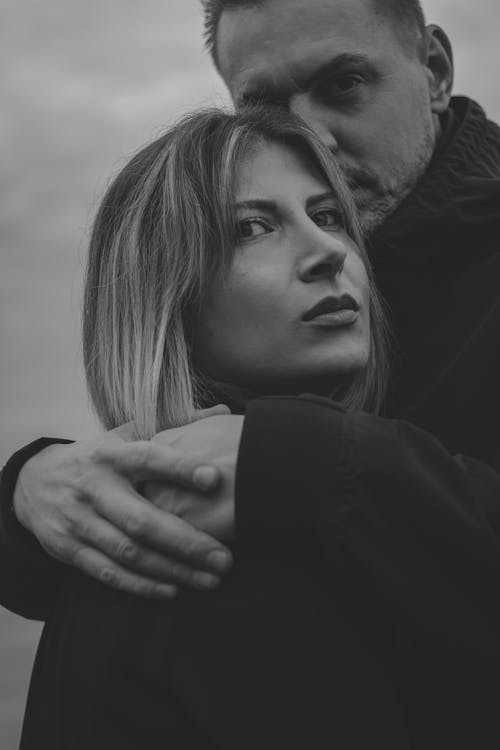 Free Black and White Photo of Man Hugging Woman Stock Photo