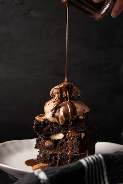 Free Brownies Cake With Chocolate Ice Cream on Top Stock Photo