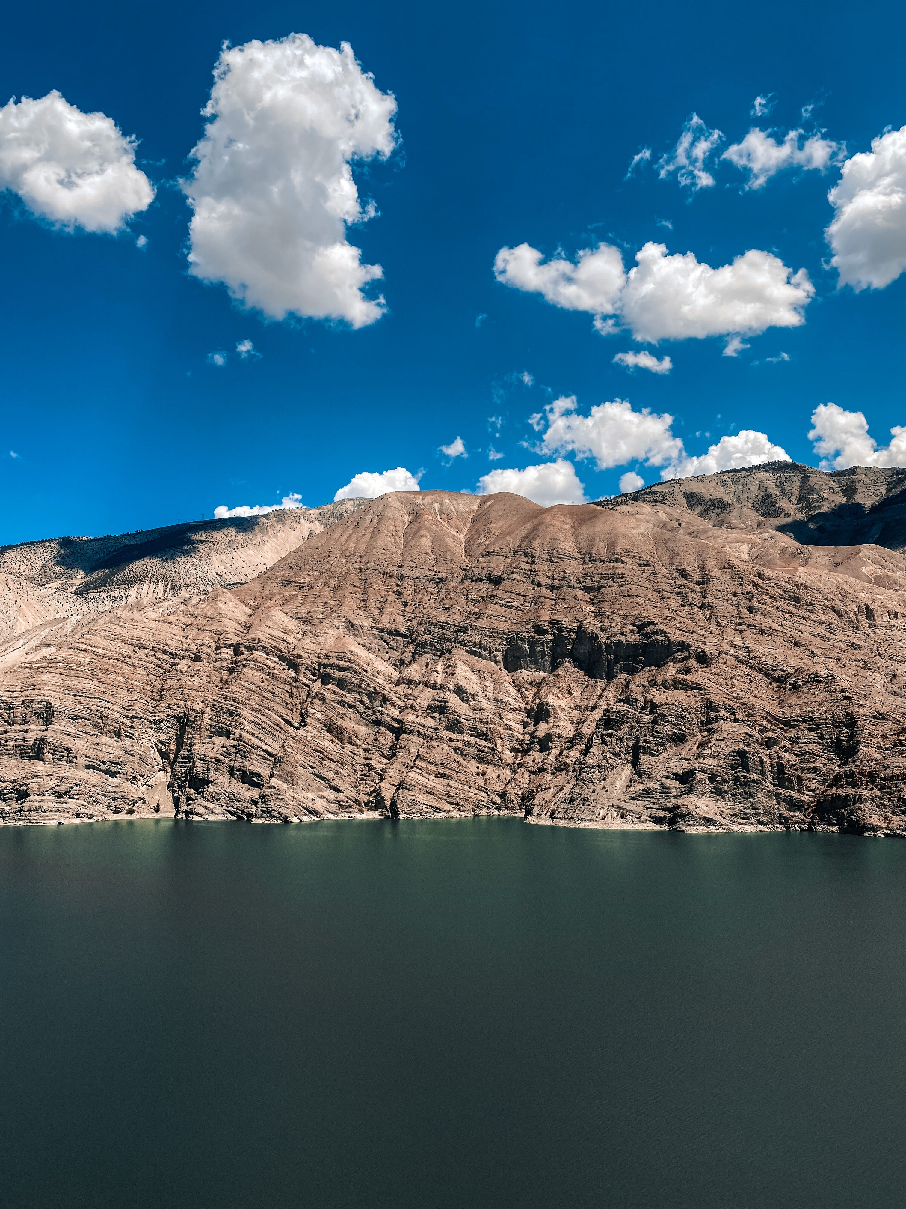 Brown Rocky Mountain Under the Blue Sky · Free Stock Photo