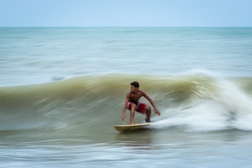 Man Surfing on Sea Waves