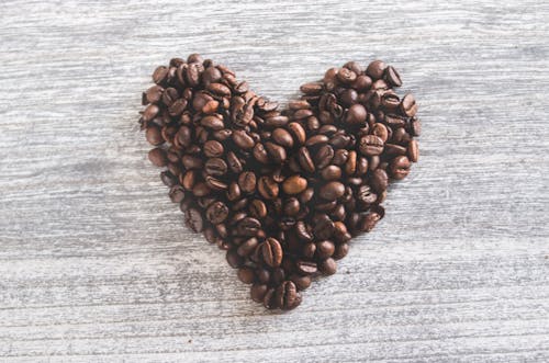 Free Flatlay Photo of Heart Shaped Coffee Beans  Stock Photo