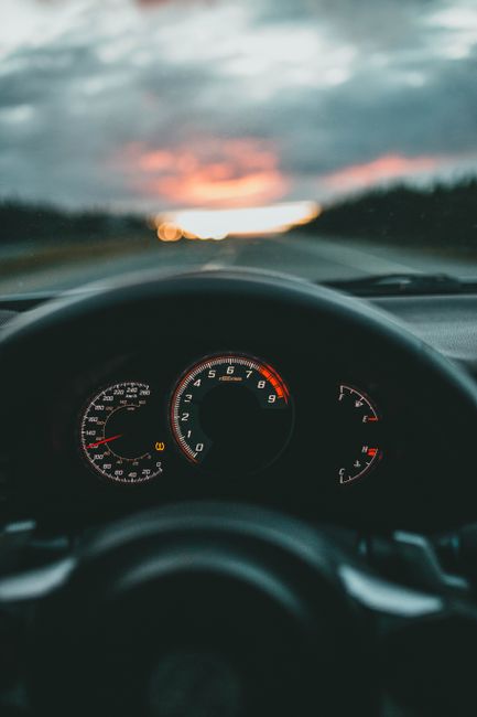 car dashboard speedometer driving road