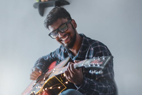 Free Man Playing Guitar Stock Photo