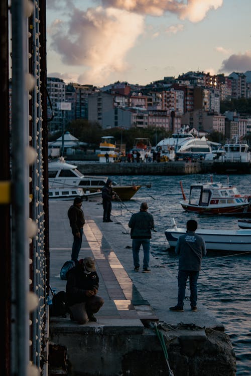 People Fishing on the River Side