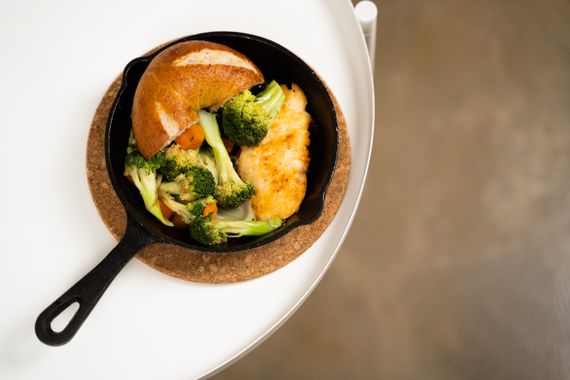 Colorful chicken and vegetable skillet meal in a cast iron pan