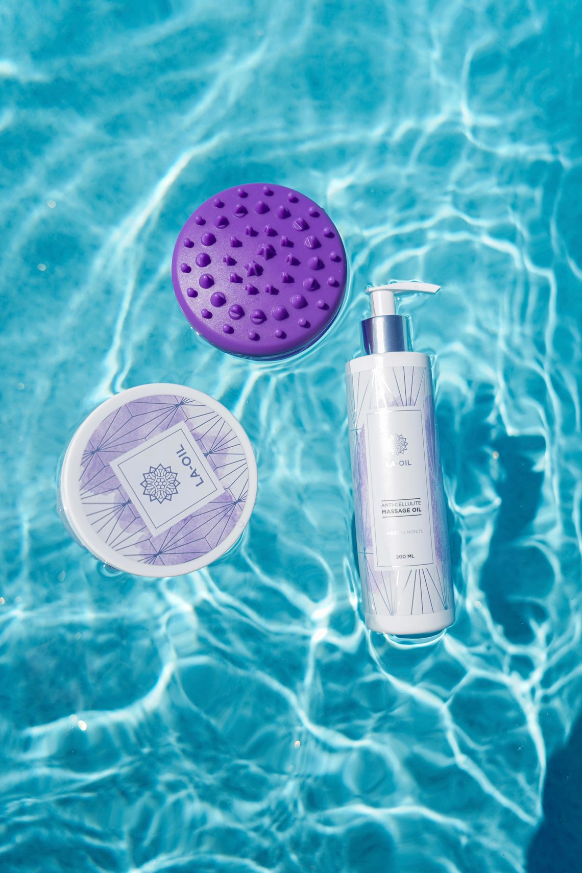 Skincare pump bottle and body care products floating on clean water