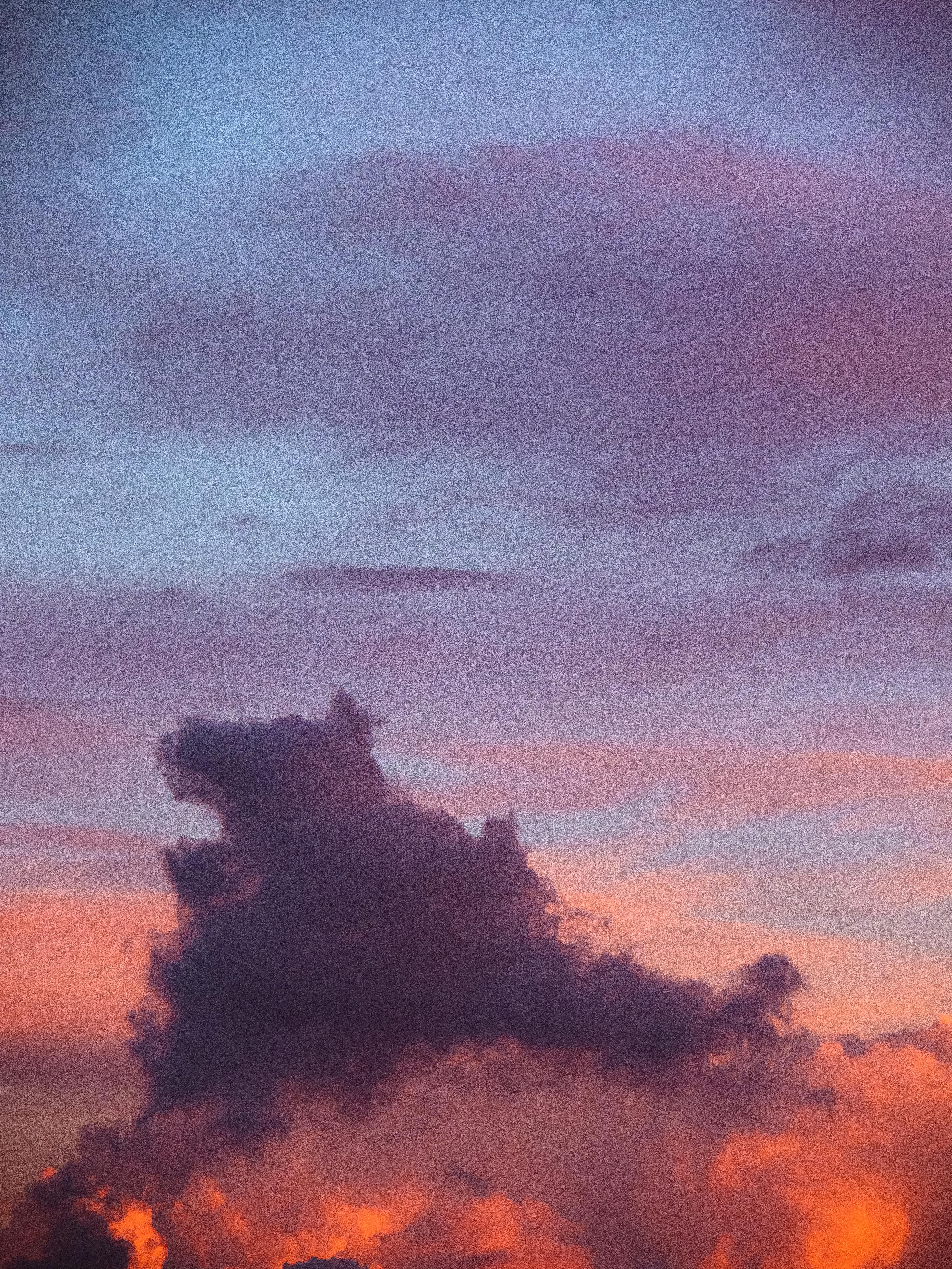 Stunning cloud formation against a colorful sunset sky, capturing nature's beauty.