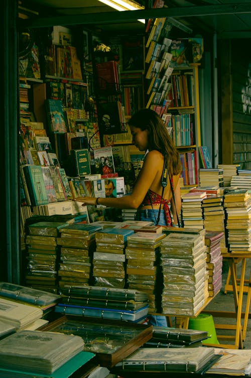 Woman Searching Books in the Bookstore