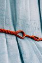 Blue fabric with red string