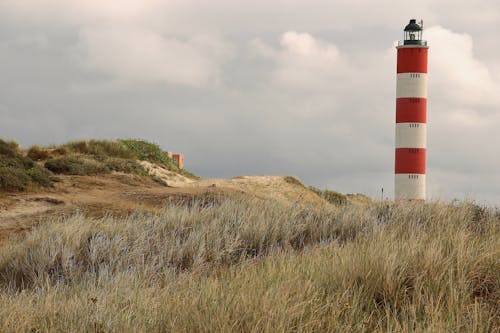 Red and White Light House on the Hill