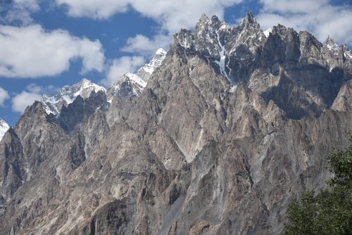 Free Majestic view of the snow-capped Passu Cones in Pakistan's Karakoram Mountain Range under a clear blue sky. Stock Photo