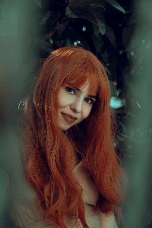 Free An Orange Haired Woman Smiling Stock Photo