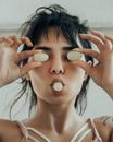 Portrait if woman with peeled rambutan fruits