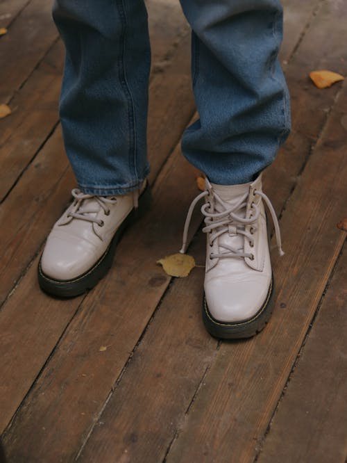 Free Person in Blue Denim Jeans Wearing White Boots Stock Photo