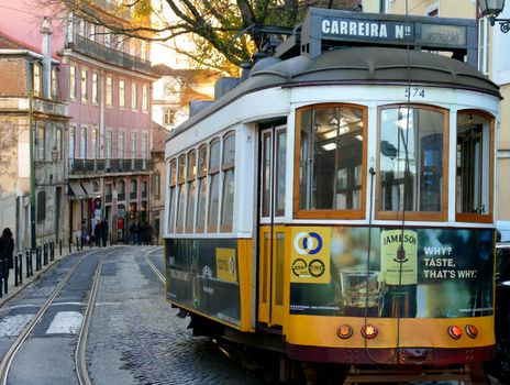 Vintage tram navigating through Lisbon's charming streets at day. Captivating urban scene.