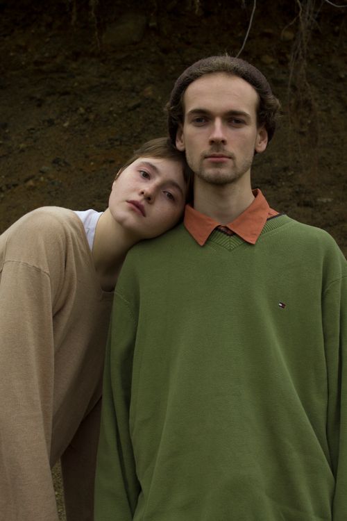 Free A serene portrait of a young Caucasian couple outdoors, embracing closely. Stock Photo