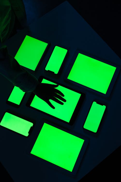 Human hand on green screens