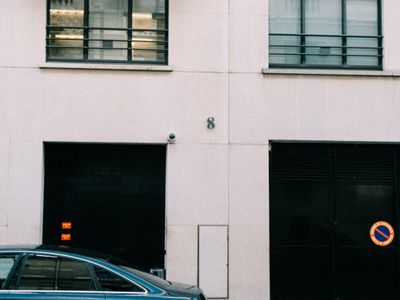 Car parked on a city street that can be secured with the KLUNK wheel lock
