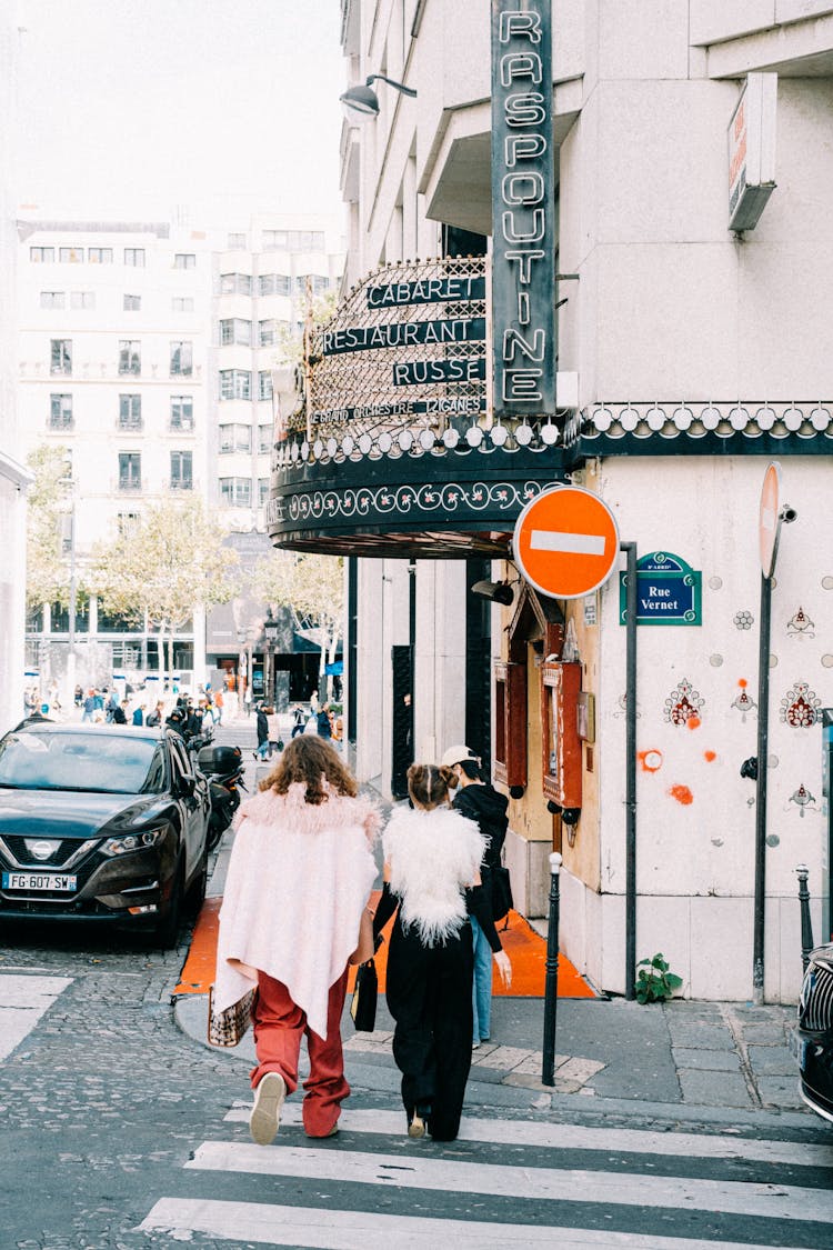 People Walking On Crosswalk