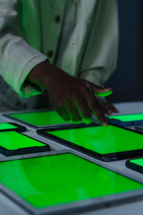 Close-up of Touching Gadget with Green Screen