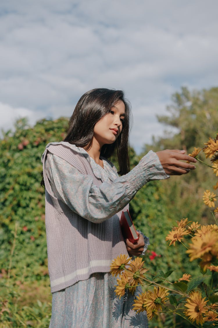 Pretty Woman Picking Flowers