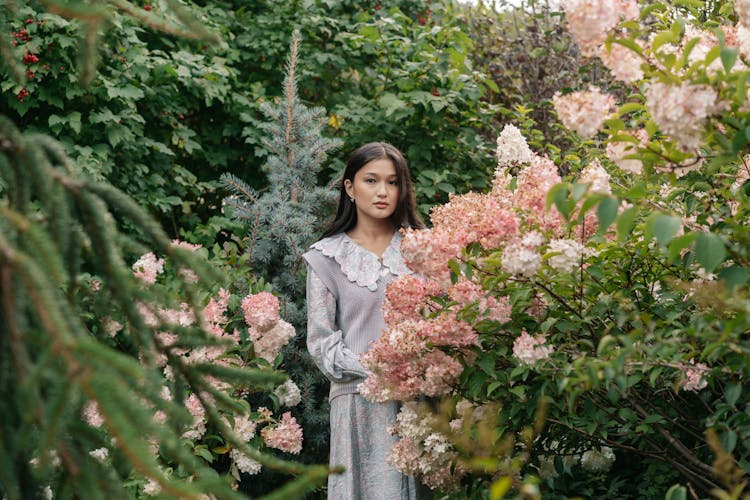 Woman Standing In The Garden 