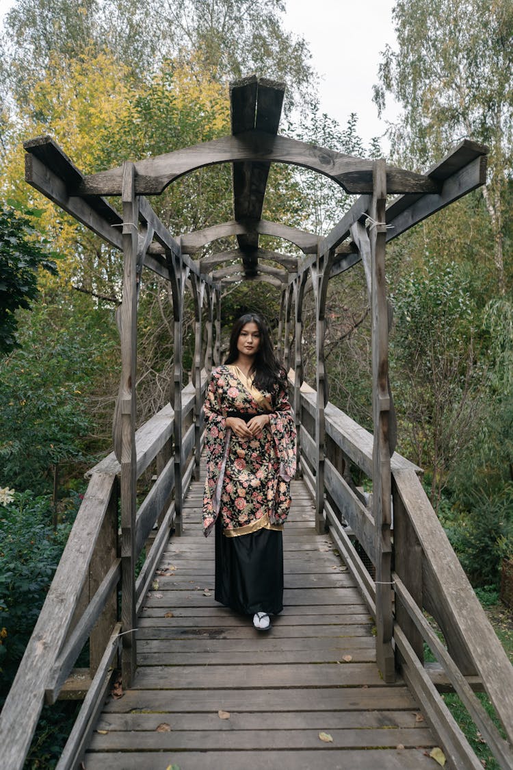 Woman In Kimono Walking On Foot Bridge