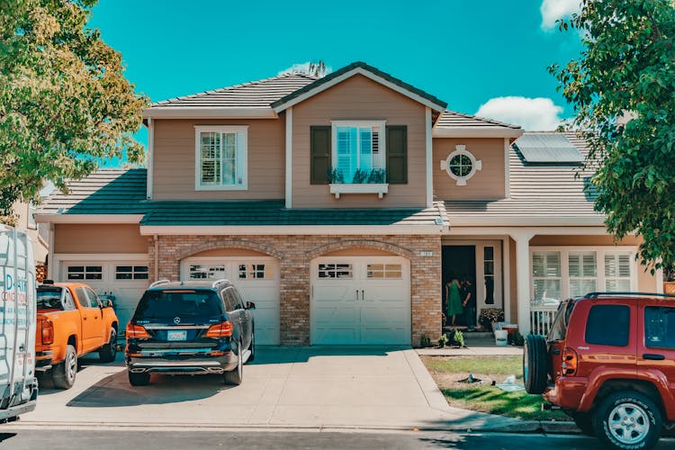 Cars Near Classic Suburb House