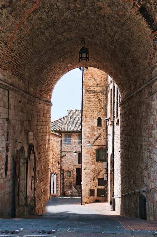 An Alleyway between Brick Building