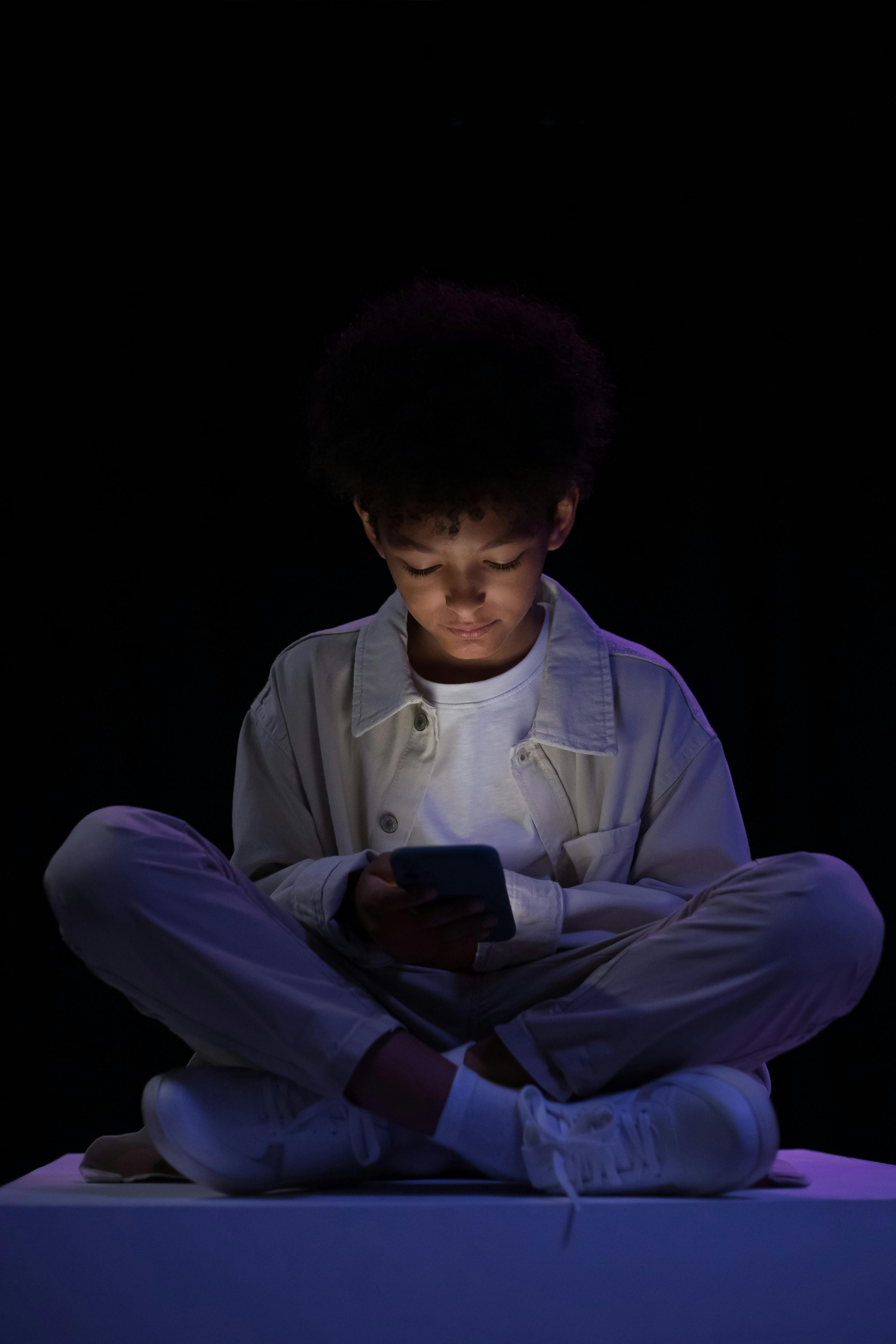 young boy using smartphone