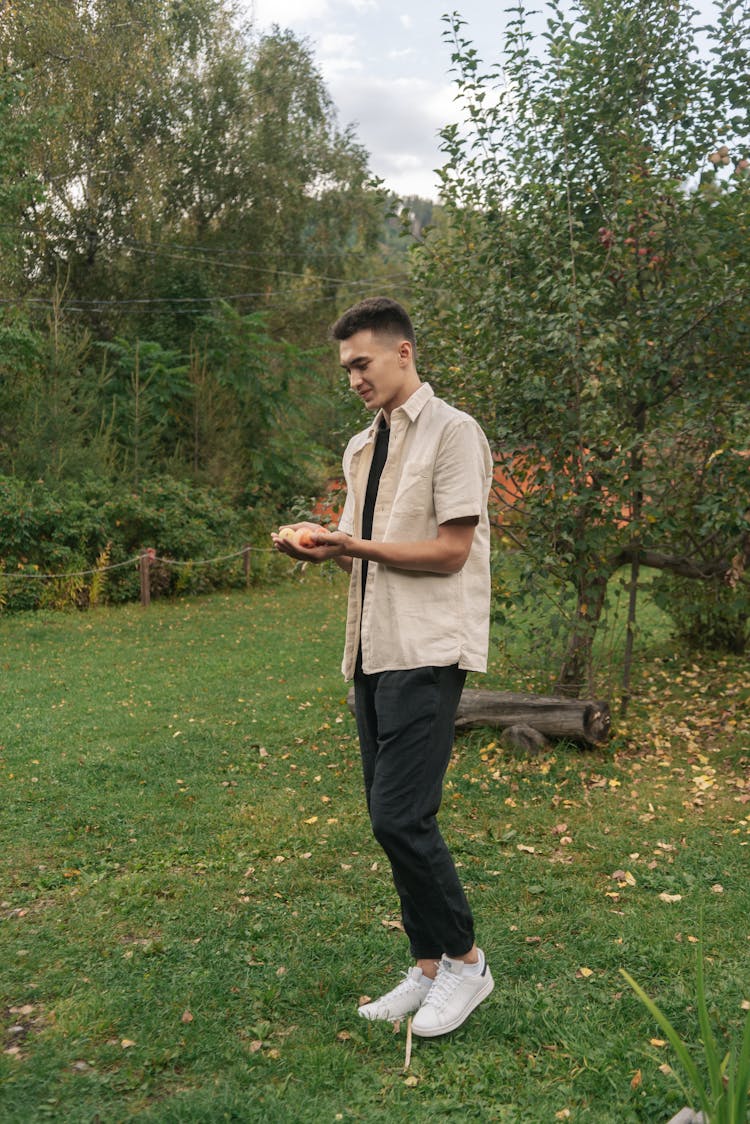 Man Holding Small Apples On His Hands