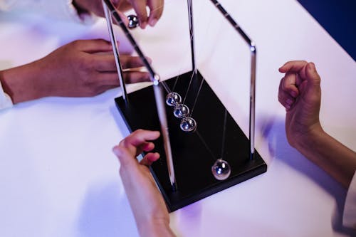 Free Newton s cradle seen from above Stock Photo