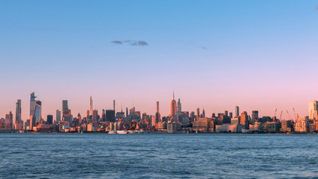 Captivating view of New York City's skyline during twilight with an iconic cityscape silhouette.