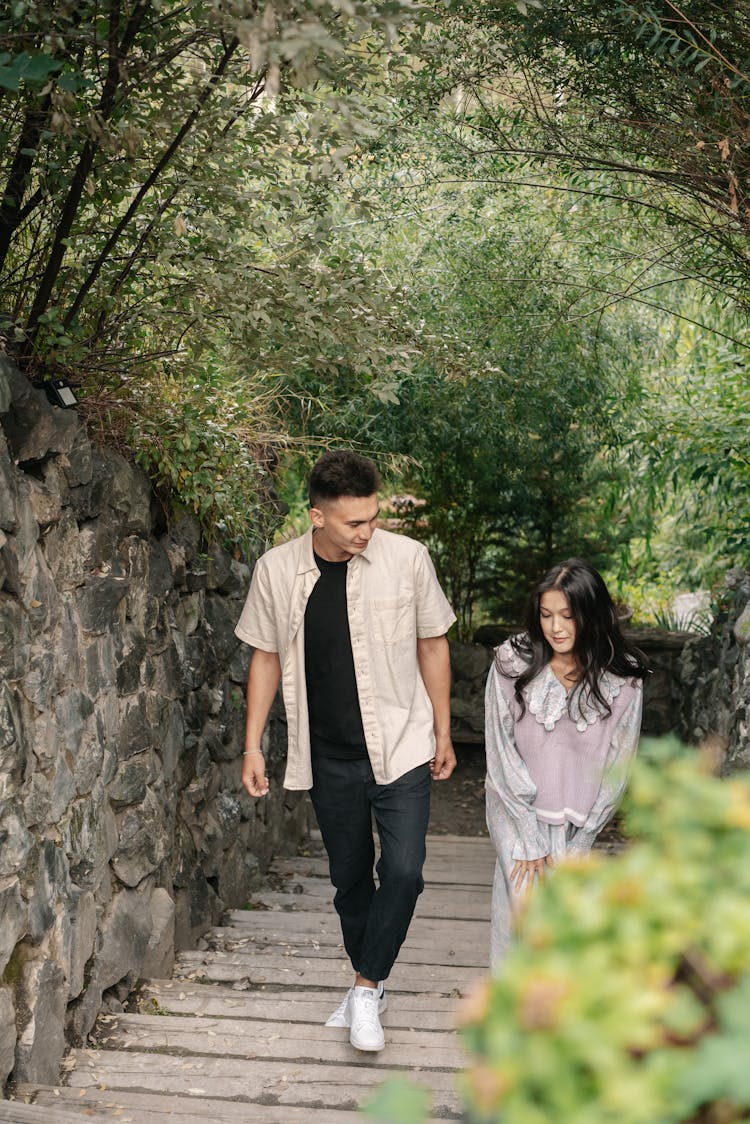 Man And Woman Going Up The Stairs