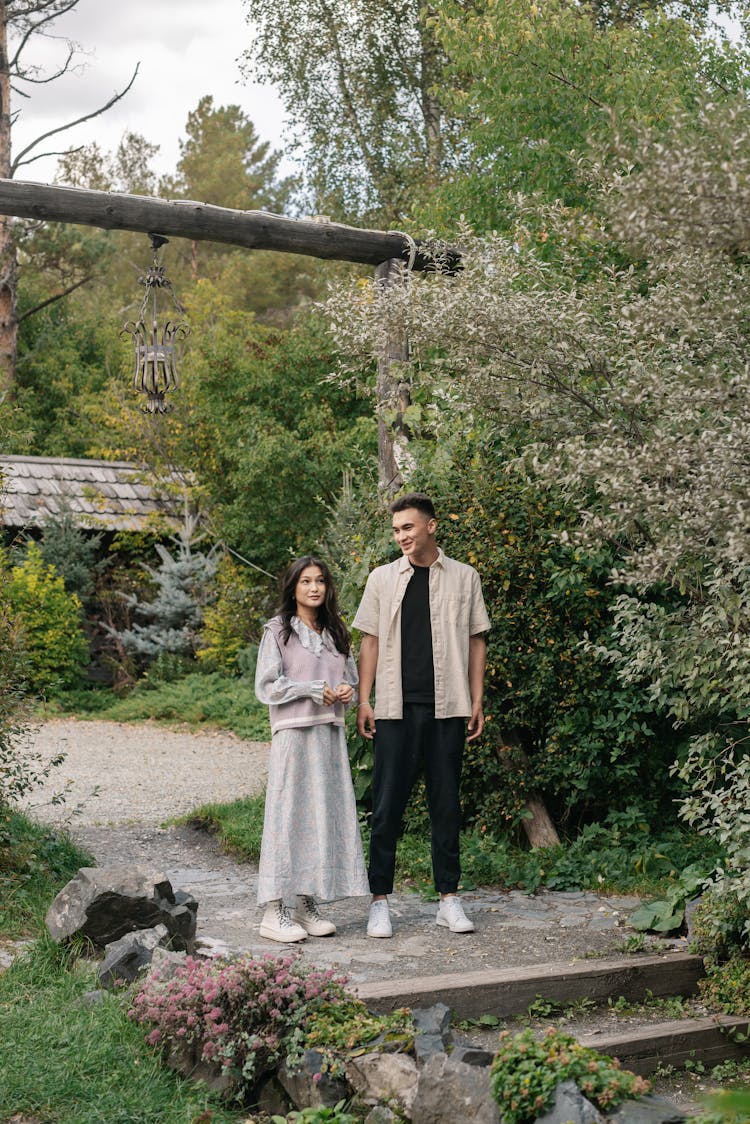 Couple Standing In The Garden