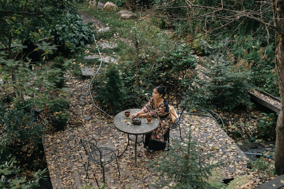 A Pretty Woman Sitting Alone in the Garden