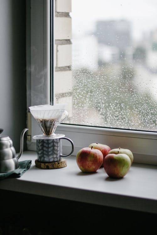  Apples Beside the Mug Cup with Coffee Dripper