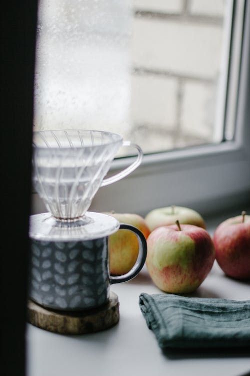 Close-up of Apples and Cups by the Window 