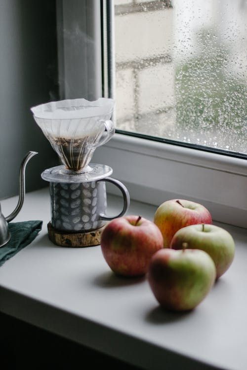  Apples  and a Mug with Coffee Dripper Near the Window