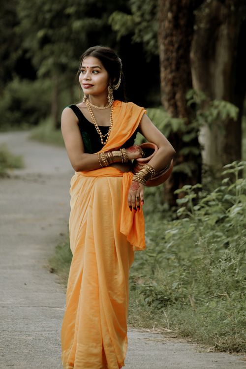 Elegant Indian Woman in Traditional Saree at Sunset · Free Stock Photo