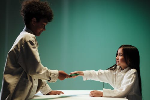 Free Brother and sister bantering about mobile phone Stock Photo