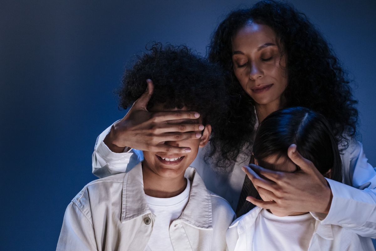 A mother guiding her children, symbolizing lifelong family protection