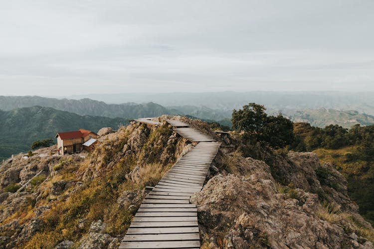 Wooden Path Leading Through Rocky Mountain Peak