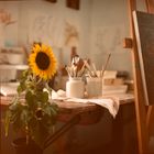 Sunlit studio bench with brushes, by Heloisa Vecchio on Pexels